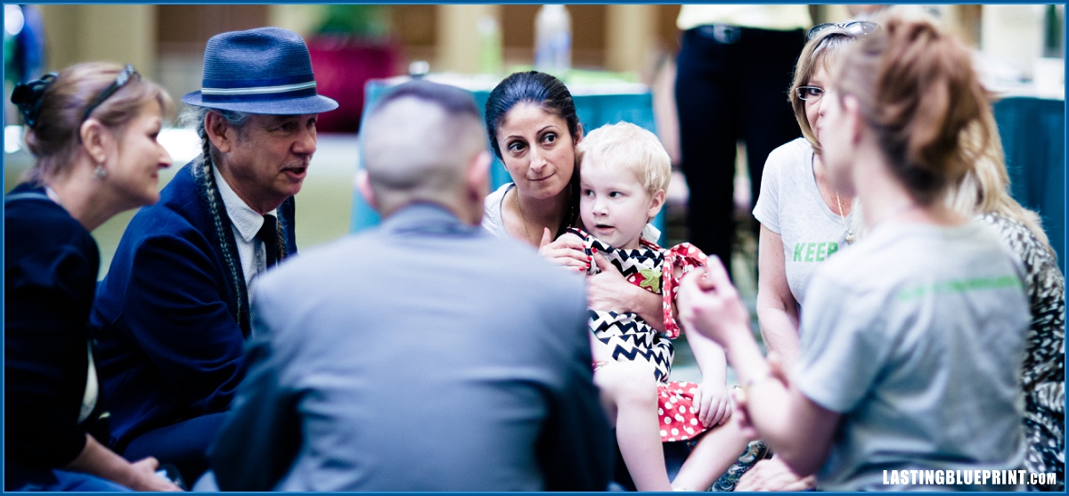 A diverse group of people conversing at caribe royale. Captured by orlando video production company.