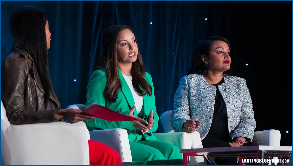Three women panelists engaged in a discussion event.